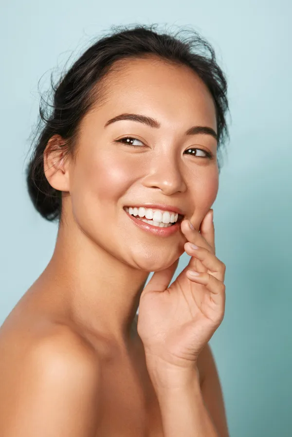 Dysport-Facial-Injections-Treatment An asian woman with radiant skin. Get Dysport facial injections from Blessed Beauty Boutique in Greater Phoenix.