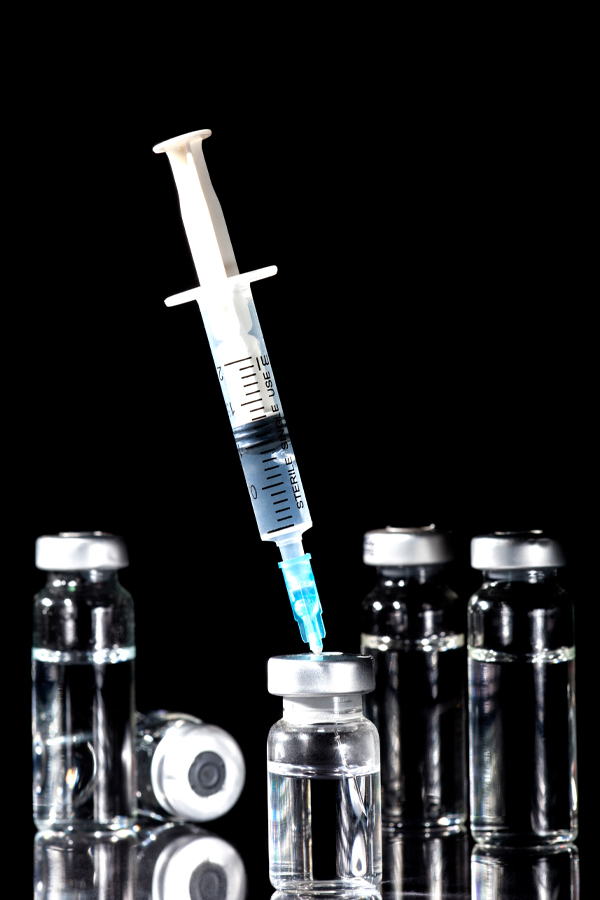 Jueveau-Facial-Injections-Treatment Close-up of a syringe and vials. Get Jueveau facial injections from Blessed Beauty Boutique in Greater Phoenix.