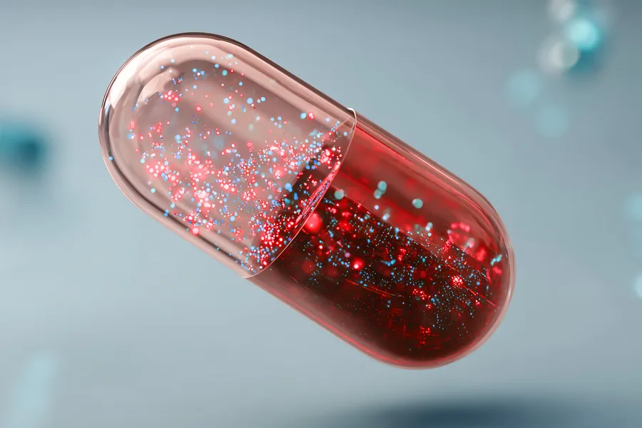 NovaPod-Capsule-Clinic 3D illustration of a sparkle-filled red capsule floating in blue-gray plasma. Contact us about the NovaPod Capsule from Blessed Beauty Boutique in Greater Phoenix.