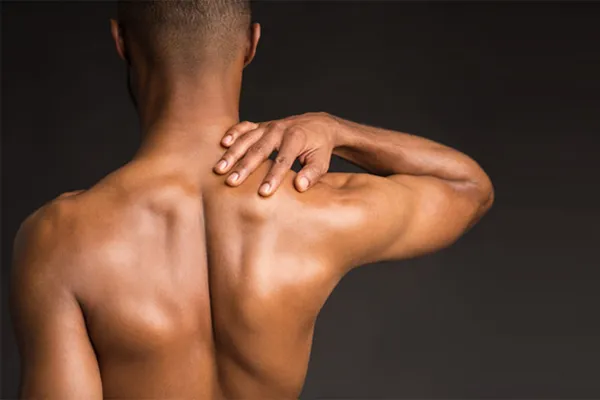 PRP-and-Stem-Cell-Microneedling-for-Back-Clinic A man with a toned back seen from behind. Get PRP and Stem Cell Microneedling for Back Skin Tightening from Blessed Beauty Boutique in Greater Phoenix.