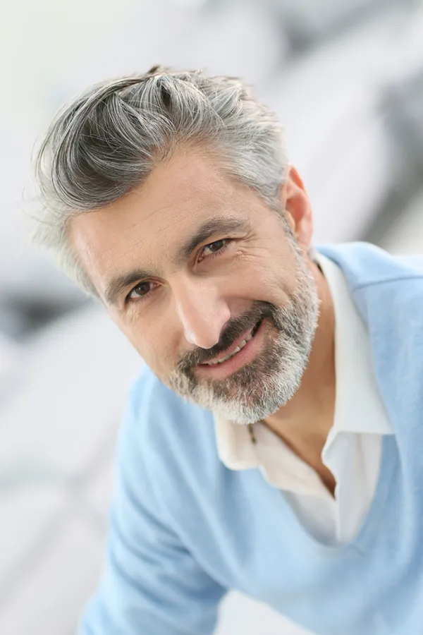 ProCell-Hair-Restoration-Treatment A mature man with a full head of salt and pepper hair and a beard. Get ProCell therapy for hair restoration from Blessed Beauty Boutique in Greater Phoenix.
